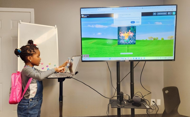child-showing-website
